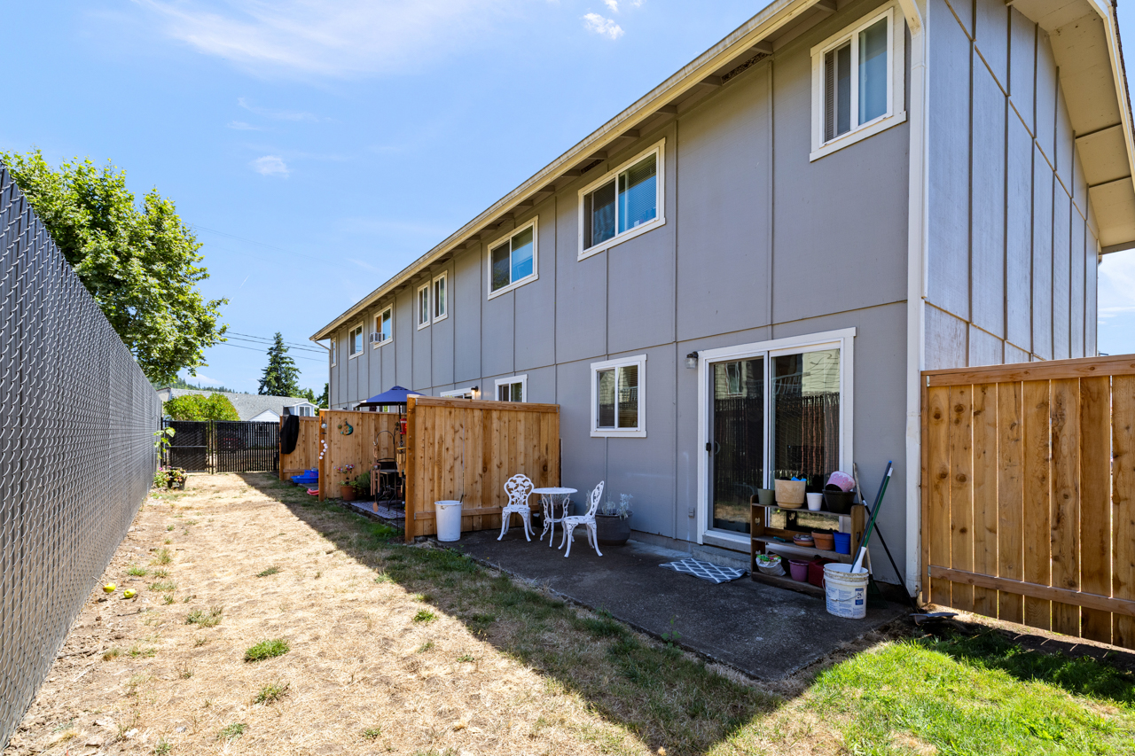 Rear elevation with fenced private patios